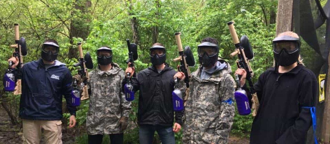 5 paintball players with masks on